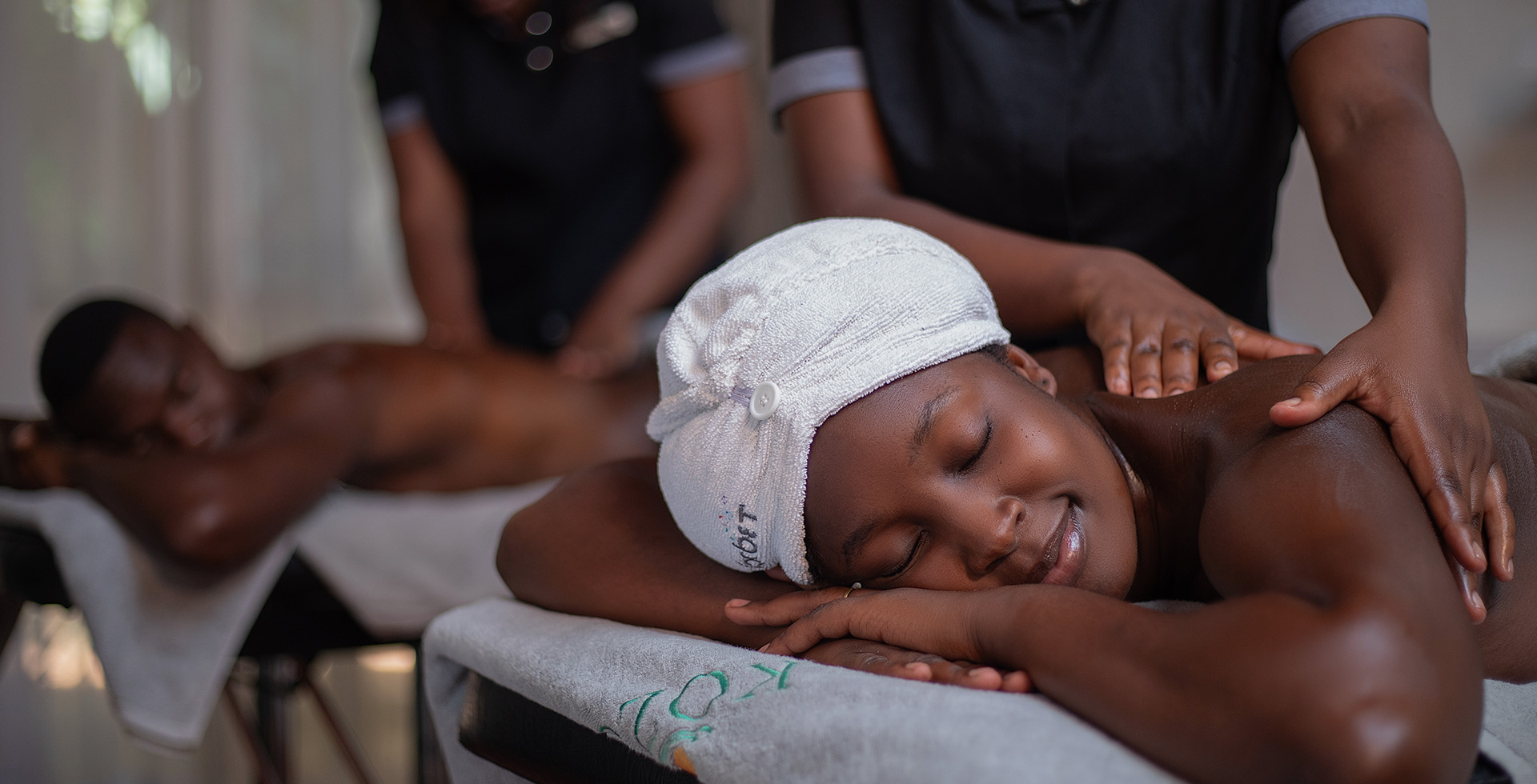 Client relaxing with a towel wrap during a massage at Kozo Hair & Day Spa, Lusaka
